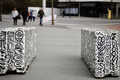 Close-up of zebra crossing on street in city