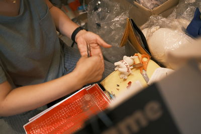 Midsection of woman holding ice cream