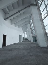 Low angle view of empty corridor in building