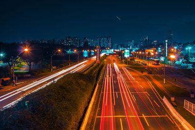 High angle view of light trails on road at night