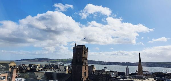 Panoramic view of buildings in city against sky