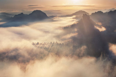 Scenic view of mountains against sky during sunset