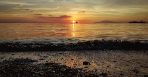 Scenic view of sea against sky during sunset