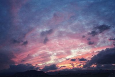 Low angle view of dramatic sky during sunset
