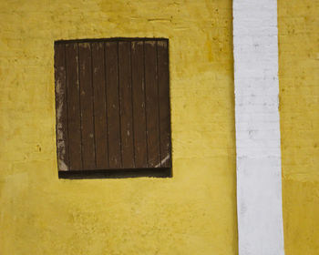 Directly above shot of yellow wall of building