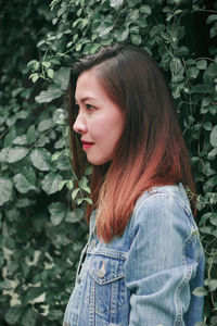 Portrait of a beautiful young woman looking away