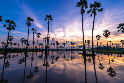 Scenic view of lake against sky during sunset