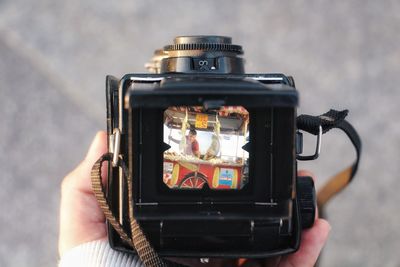 Close-up of hand holding camera