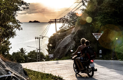 People cycling on road