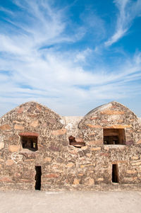 Old building against cloudy sky