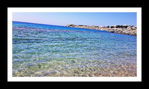 Scenic view of sea against clear blue sky