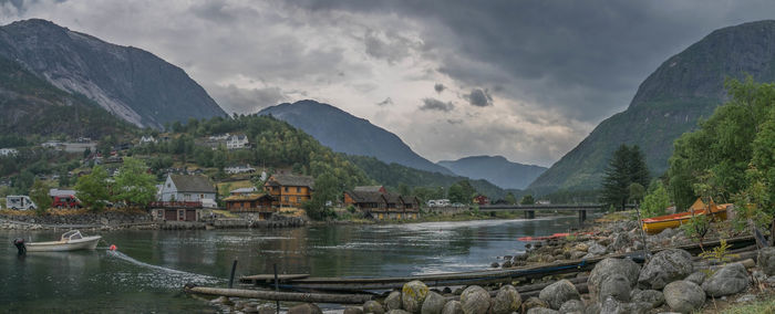 Panoramic view of lake and buildings against sky