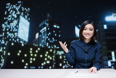 Portrait of young woman using mobile phone