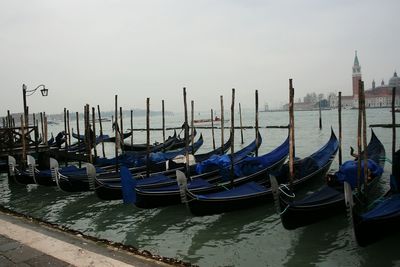 Boats moored in canal