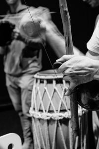 Close-up of man playing musical equipment