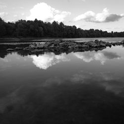 Reflection of clouds in calm lake