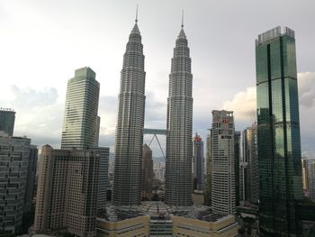 Modern buildings in city against sky