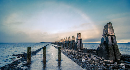 Scenic view of tidal causeway against sky