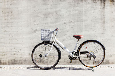 Bicycle leaning against wall