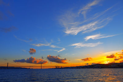 Tagus river and ponte 25 de abril in lisbon portugal . flowing river water and twilight