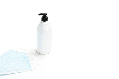 High angle view of bottle on white background