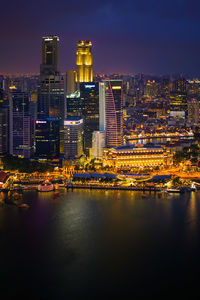 Illuminated buildings in city at night