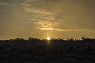 Scenic view of landscape at sunset