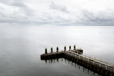 Pier on sea against sky