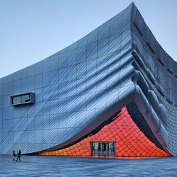 Modern building against clear blue sky