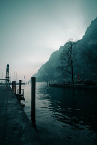 Pier over lake against sky