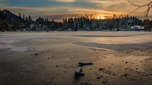 Scenic view of landscape against sky during winter