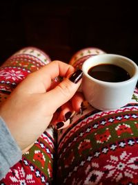 Close-up of woman holding coffee cup