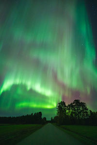Scenic view of landscape against sky at night