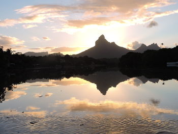 Scenic view of lake against sky during sunset