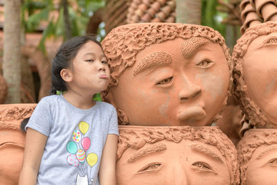 Portrait of mother and girl wearing mask