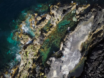 Aerial view of rock in sea