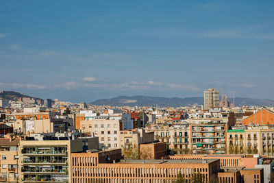 High angle view of buildings in city against sky