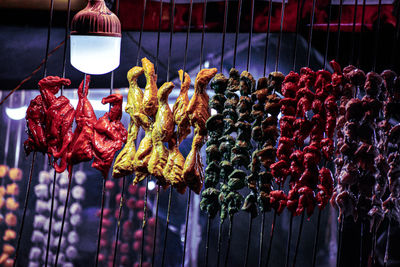 Close-up of decorations hanging for sale
