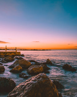 Scenic view of sea against sky during sunset