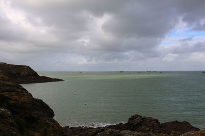 Scenic view of sea and cliff