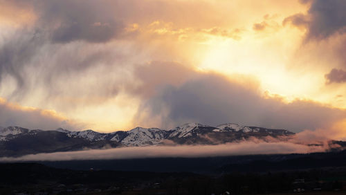 Scenic view of mountains against sky during sunset