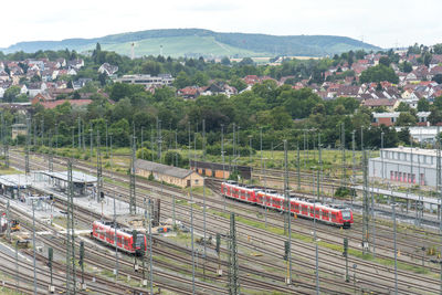 High angle view of train amidst buildings in city