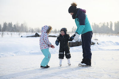 Full length of women in snow during winter