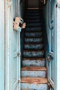 Rusty metal on staircase of old building