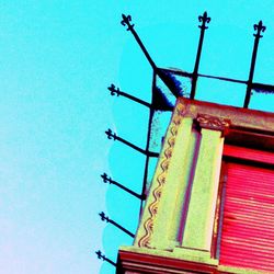 Low angle view of built structure against clear blue sky