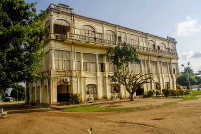 Facade of old building against sky