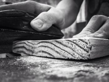 Close-up of carpenter working at shop