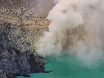 Smoke emitting from volcanic mountain