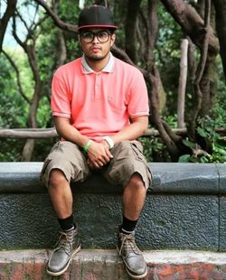 Portrait of young man sitting outdoors