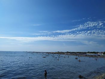 Scenic view of sea against blue sky